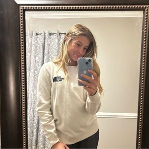 The North Face tan sweatshirt.